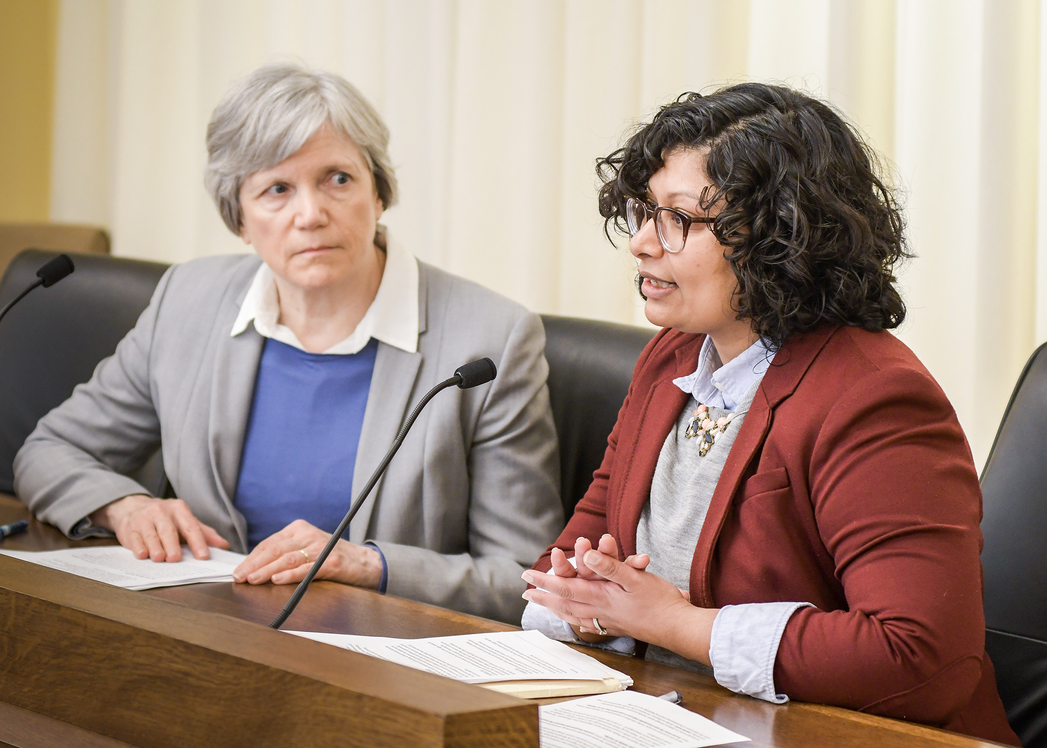 Rinal Ray, associate executive director for People Serving People, testifies in support of a bill, sponsored by Rep. Laurie Pryor, left, to modify the child care assistance program. Photo by Andrew VonBank